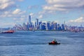 Tugboat in Harbor with New York City in Background Royalty Free Stock Photo