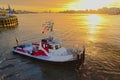 Tugboat in river Scheldt in sunst light with the city of Antwerp in the background Royalty Free Stock Photo
