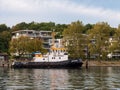 Tugboat Holtenau moored along quay of Kiel-Holtenau in Kiel Fjord, Schleswig-Holstein, Germany
