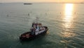 Tugboat IVONNE C in Venice Lagoon at sunset