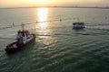 Tugboat IVONNE C in Venice Lagoon at sunset