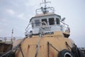 tugboat parked at commercial port,