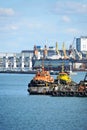 Tugboat and port cargo crane Royalty Free Stock Photo
