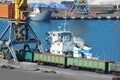 Tugboat and port cargo crane Royalty Free Stock Photo