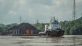 Tugboat pull heavy loaded barge of coal Royalty Free Stock Photo