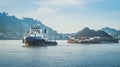 Tugboat pull heavy loaded barge of coal Royalty Free Stock Photo