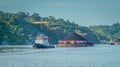 Tugboat pull heavy loaded barge of coal Royalty Free Stock Photo