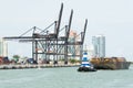 Tugboat pulling a barge in the Port of Miami