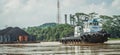 Tugboat pull heavy loaded barge of coal Royalty Free Stock Photo