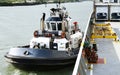 Tugboat Pulling Industrial Ship