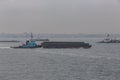 Tugboat pushing barge on the Hudson River