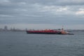 Tugboat pushing a barge in New York Harbor