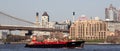 Tugboat pushing a barge RTC 82 across New York harbor, NY, USA