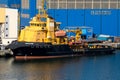Tugboat at the quay outside the Damen shipyard in Gdynia, Poland. Royalty Free Stock Photo