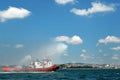 Tugboat squirts water in Istanbul, Turkey Royalty Free Stock Photo