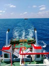 Tugboat towing the barge in the ocean