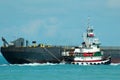 Tugboat towing barge