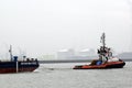 Tugboat is towing cargo platform towards the North Sea