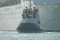 Tugboat tows cruise ship Royalty Free Stock Photo