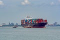 Tugboats help a large container ship. Royalty Free Stock Photo