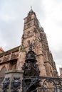 Tugendbrunnen in front of St. Lorenz church in the city Nuremberg, Bavaria, Germany Royalty Free Stock Photo