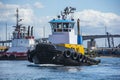 Tugs on Elliott Bay with West Seattle Bridge in the background