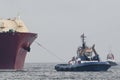 LNG TANKER AND TUGBOATS Royalty Free Stock Photo