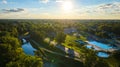 Tuhey Pool aerial in late afternoon with golden sunshine over neighborhood and White River, Muncie Royalty Free Stock Photo