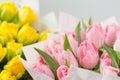 Tuips closeup. Flower shop concept. Mixed color. Fresh spring flowers in refrigerator room for flowers. Bouquets on Royalty Free Stock Photo