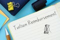 Tuition Reimbursement sign on the piece of paper Royalty Free Stock Photo