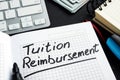 Tuition reimbursement written on a page