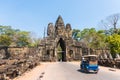Tuk tuk and angkor thom gate in siem reap cambodia Royalty Free Stock Photo