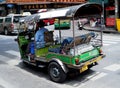 Tuk tuk driver looks for customers