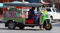 Tuk tuk driver waits for potential passengers