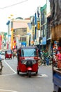 Tuk tuk mototaxi rides along Colombo street in Sri Lanka