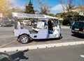 tuk tuk near tourist spot in Lisbon painted in traditional blue colors tiles of Royalty Free Stock Photo