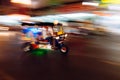 The tuk-tuk is passing by at a blurred speed, blurred images taking pictures with slow shutter speeds