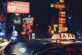 Tuk-Tuk Taxi sign with defocused lights blur in Chinatown in Bangkok at night , Thailand , Southeast asia Royalty Free Stock Photo