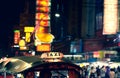 Tuk-Tuk Taxi sign with defocused lights blur in Chinatown in Bangkok at night , Thailand , Southeast asia Royalty Free Stock Photo