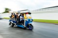 A Tuk-tuk in motion blur. Bangkok, Thailand. Royalty Free Stock Photo