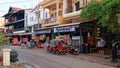 Tuk tuk parked near a small Cambodian shop, a typical scene of Asian life