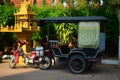 Tuk tuk in Phnom Penh, Cambodia, close to a buddhist temple. Royalty Free Stock Photo