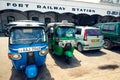Tuk tuk taxis parked in front of Colombo Fort train station