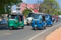 Tuk-tuks in motion on a city street. Trincomalee, Sri Lanka Royalty Free Stock Photo
