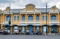 Tuk-tuks are parked to pick up tourists around the centuries-old building called Wang Tha Chang in the past in Bangkok