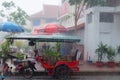 Tuktuk motocycle during rain monsoon in Kampot