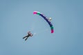 Skydiver comes down from the sky on a paraglider. Parachutist landing