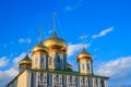 Tula city, Russia - May 2019: golden domes of orthodox uspenski cathedral of Tula Kremlin shines in the warm rays with blue sky. Royalty Free Stock Photo