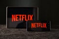 Tula 24 09 2019: Netflix logo on the tablet and phone display. Royalty Free Stock Photo