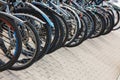 Tula, Russia - August 2, 2021: Row of many bicycle at public outdoor bicycle parking under summer daylight.